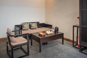 Posezení v ubytování Tingjian Musu Private Soup Design Homestay - South Gate of Wuzhen Xizha Scenic Area