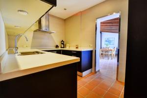 A kitchen or kitchenette at Cala Estellencs Beach House by Slow Villas