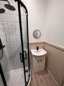 a bathroom with a shower and a sink at 73 George Street. Appartment 1 in Oban
