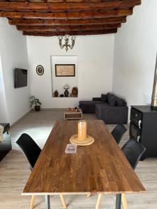 a living room with a wooden table and a couch at Irini Panorama in Agia Galini