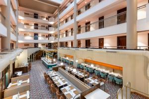 an overhead view of the dining hall of a hotel at Citadel Sarovar Portico Bengaluru in Bangalore