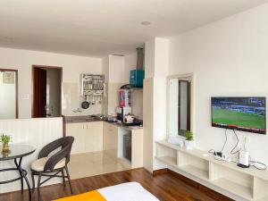 a living room with a television on a wall at Himalayan laligurans Hospitality in Kathmandu