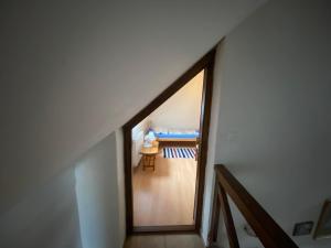 A bed or beds in a room at Vadászkürt Vendégfogadó