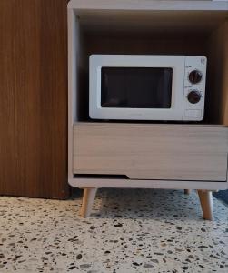 a microwave oven sitting on top of a cabinet at Incheon Juan Glam in Incheon