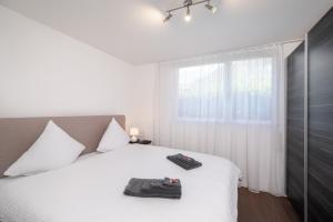 Letto o letti in una camera di Schöne Parterrewohnung in Matten