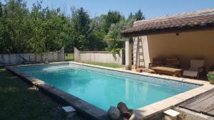 a person laying on the ground in a swimming pool at Eden in Le Thor