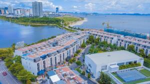 an aerial view of a building next to a body of water at Resort royal lotus Ha Long in Ha Long
