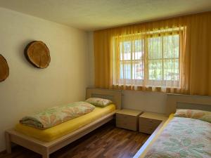 Un pat sau paturi într-o cameră la Feichterhof