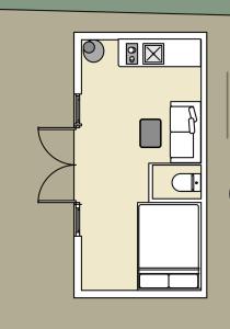 a floor plan of a kitchen with a refrigerator at Henny Riverside Glamping in Sudbury