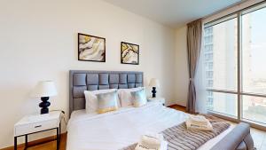 Postel nebo postele na pokoji v ubytování Primestay - Meera Tower 1Br in Al Habtoor City