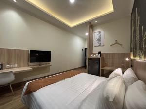 TV a/nebo společenská místnost v ubytování D'Bamboo Suites