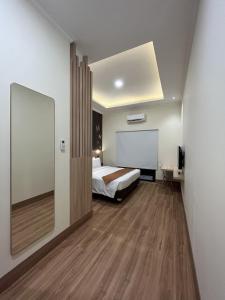 Postel nebo postele na pokoji v ubytování D'Bamboo Suites