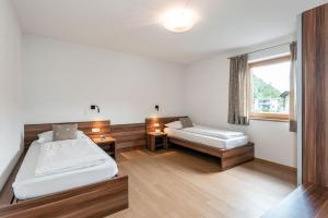 Ένα ή περισσότερα κρεβάτια σε δωμάτιο στο Appartements Toni