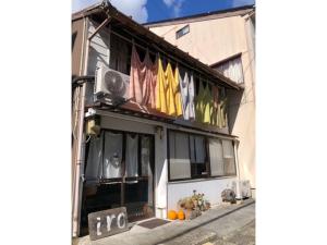 a building with flags on the side of it at iro - Vacation STAY 15671v in Sado