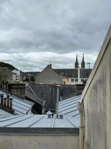 a view of roofs of a city with buildings at Le Ty Kerguelen in Quimper