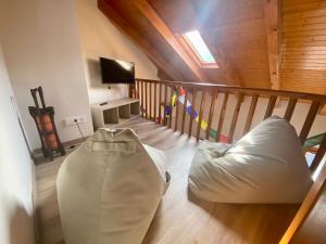 a living room with a bean bag chair on the floor at Duplex Kasares en Sesué No VU HUESCA24037 in Sesué