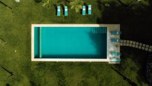 an overhead view of a large swimming pool at Villa Camélia Boutique House in Camacha