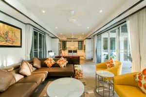a living room with a couch and chairs at Katamanda Villa Mila A1 in Kata Beach