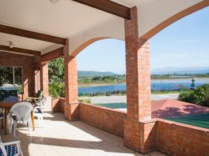 an outdoor patio with a view of the water at Water's Edge in Sedgefield