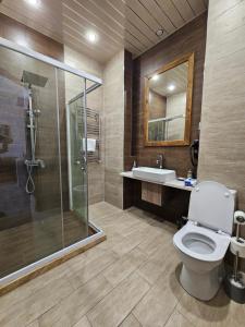 a bathroom with a toilet and a sink and a shower at Via Gyumri in Gyumri