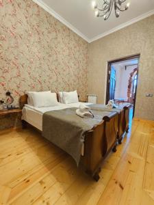 a bedroom with a large bed in a room at Via Gyumri in Gyumri