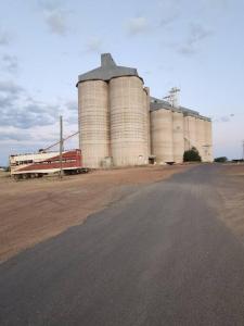 a large silo with a road in front of it at 40 On North. in Wandoan