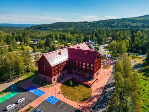 an overhead view of a large red building in a parking lot at Break Sokos Hotel Koli Kylä in Kolinkylä +61 photos