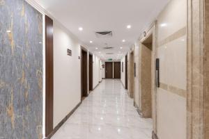 a corridor of an office building with a long hallway at Snood Ajyad Hotel Tower 1 in Makkah
