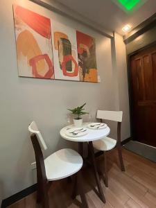 a small table and chairs in a living room at Oppas Studio Unit near Sm uptown in Cagayan de Oro