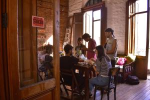 a group of people sitting at a table in a restaurant at casa vegana in Montevideo