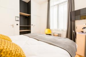 Posteľ alebo postele v izbe v ubytovaní Au Chat Qui Dort Lille - Villa Gounod