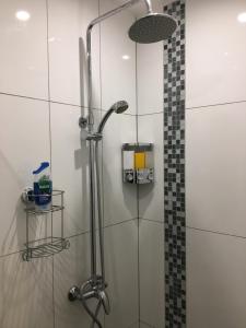 a shower with a glass door in a bathroom at Ocean Breeze 5 minutes walk to the beach - Free Parking in Lancing