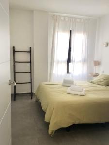 A bed or beds in a room at Casa Alejandro Las Vistas