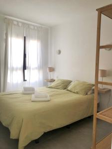 A bed or beds in a room at Casa Alejandro Las Vistas