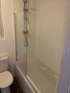 a bathroom with a shower and a toilet at May Disc - Long Stay - Contractors in Bristol