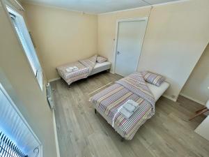 Postel nebo postele na pokoji v ubytování Gjestehuset Borggata 18