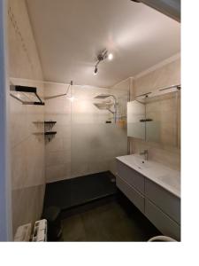 a bathroom with a sink and a mirror at CHAMBRE DE 11 M2 AVEC BALCON in Paris