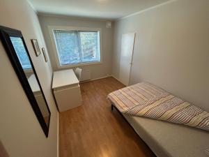 Postel nebo postele na pokoji v ubytování Gjestehuset Borggata 18