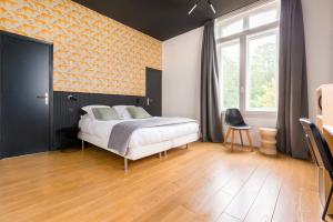 Posteľ alebo postele v izbe v ubytovaní Au Chat Qui Dort Lille - Villa Gounod