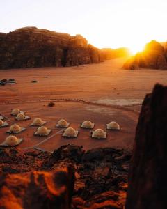 a group of rocks in the sand on a beach at Wadirum winter in Wadi Rum