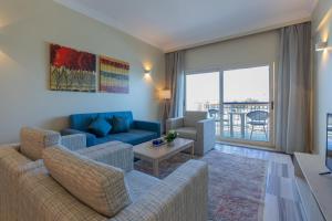 a living room with a couch and a table at Safir Marsa Matrouh Resort in Marsa Matruh