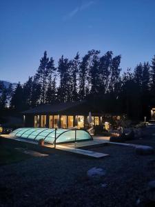 a house with a glass roof in a yard at Beautiful Villa by the sea in Porvoo