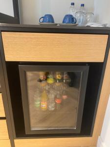 a refrigerator filled with lots of water bottles at İn The Middle Hotel in Antalya