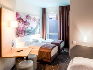Postel nebo postele na pokoji v ubytování B&B Hotel Hildesheim