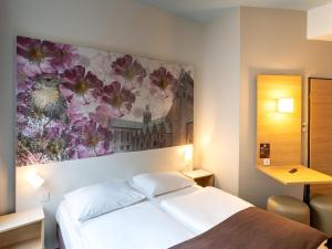 Postel nebo postele na pokoji v ubytování B&B Hotel Hildesheim