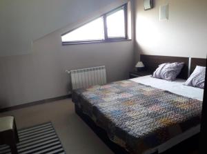 Postel nebo postele na pokoji v ubytování Apartament by Zenit in Terra Complex Massonet D28 near Bansko