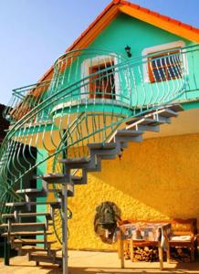 a spiral staircase on the side of a building at Chalupa Sonja in Lúčky