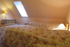 a bedroom with two beds and a window at Ferienwohnung am Technikmuseum in Dessau +20 photos
