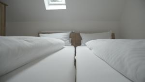 Postel nebo postele na pokoji v ubytování Fährhaus Hotel