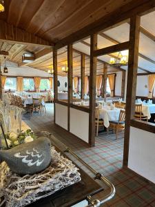 a restaurant with tables and chairs in a room at Hotel Stockhausen GbR in Schmallenberg